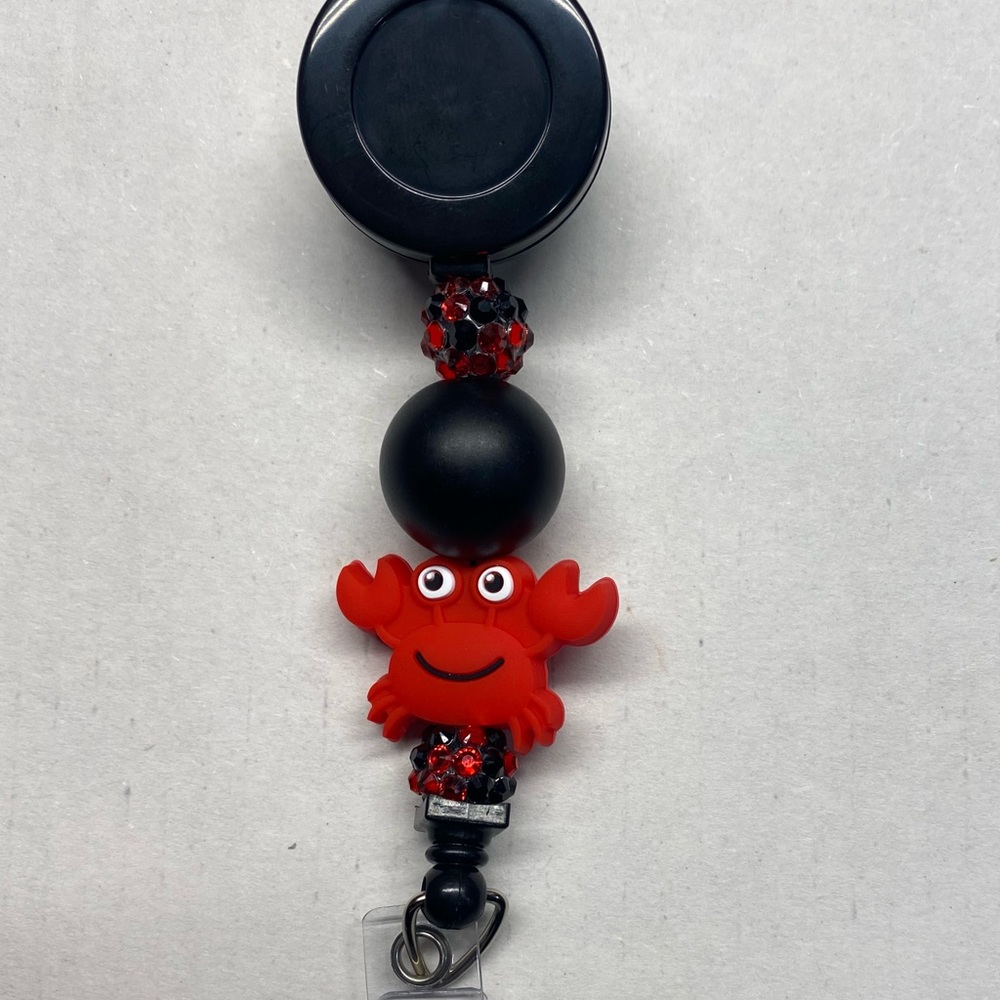 NWT CRAB BADGE REEL